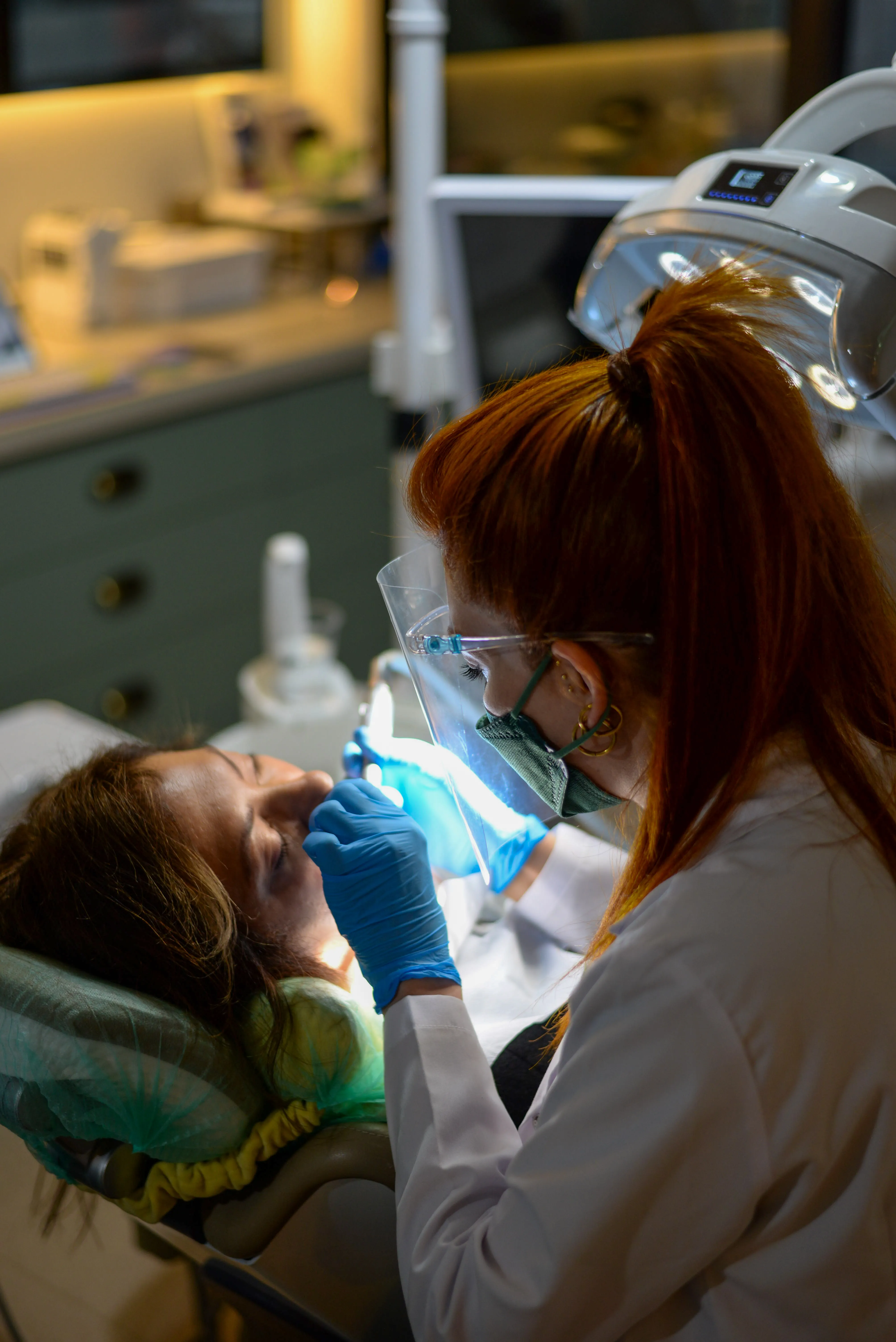 Hygienist reviewing digital X-rays with a patient