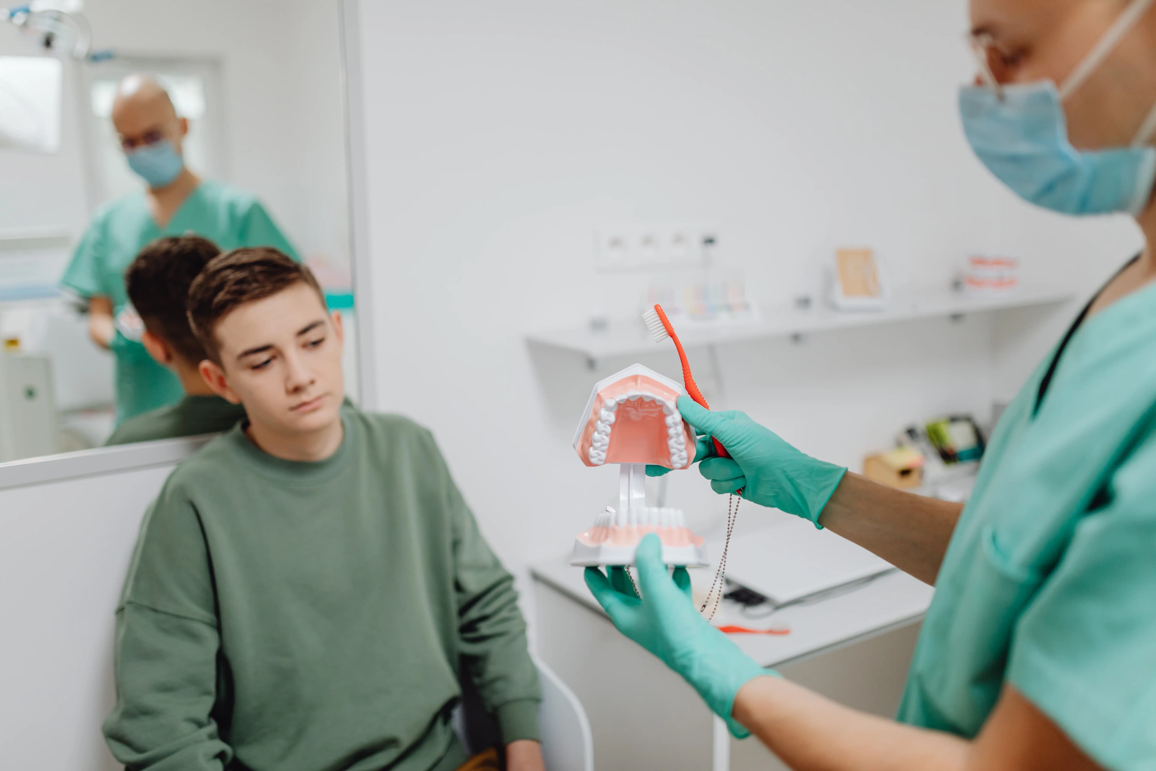 Pediatric dentist working with a young patient