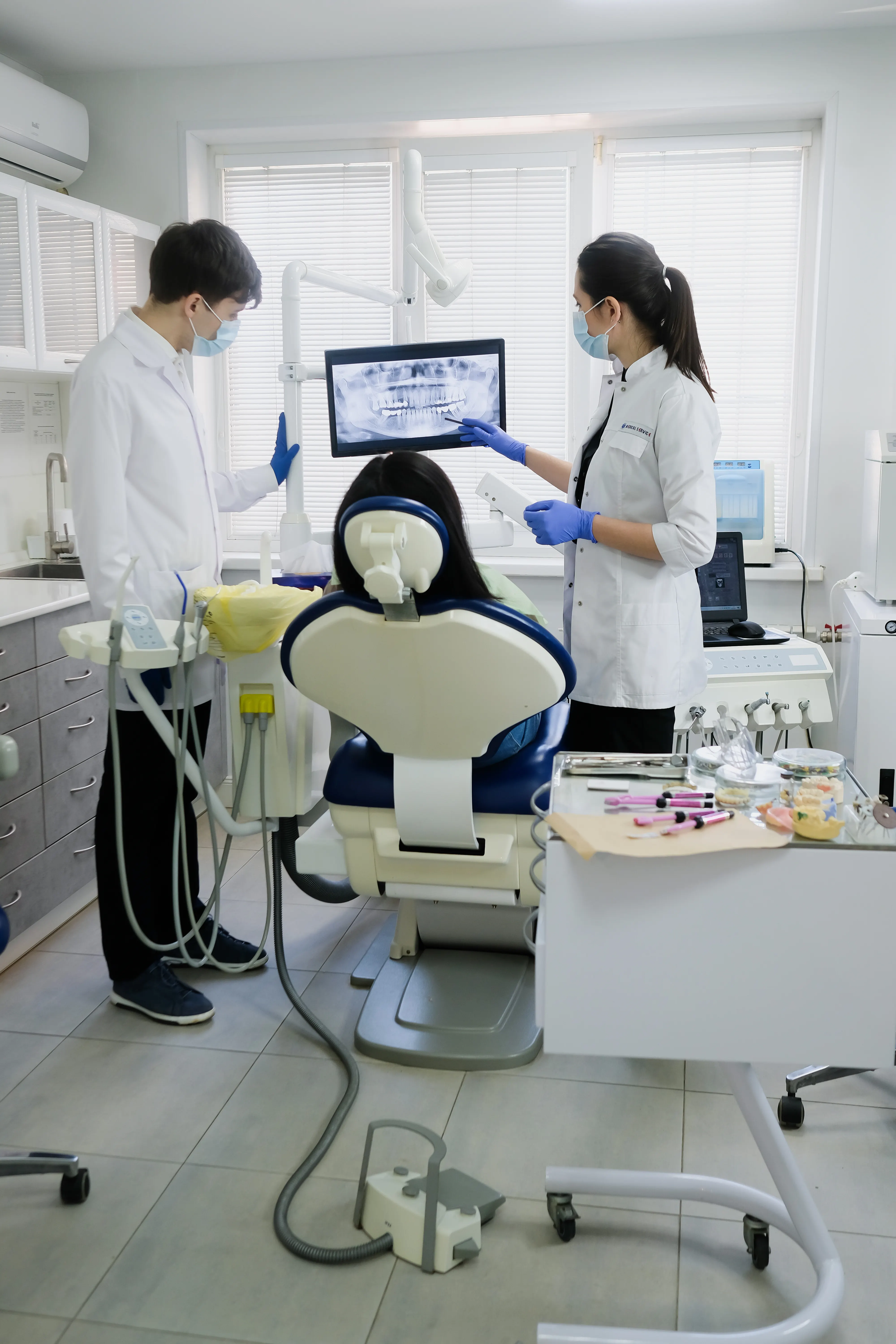 Dentist examining a patient before root canal treatment